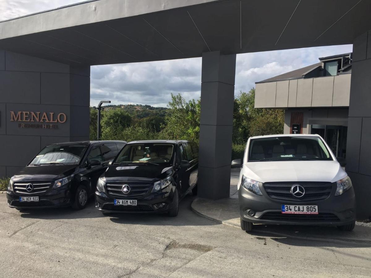 Menalo Hotel Premium Istanbul Airport Exterior photo The photo shows three Mercedes-Benz vehicles parked in front of a building with a sign that reads "MENALO." The vehicles include two black vans and one white van. The building behind them appears modern, set amidst greenery.